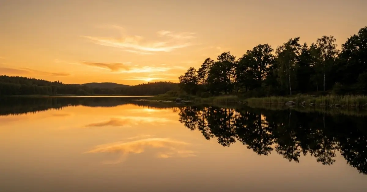 A perfectly calm lake at sunset reflecting clarity, grounding, and balance